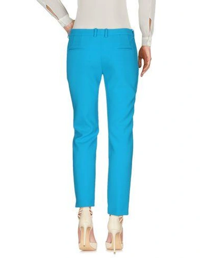 Shop Versace Casual Pants In Turquoise