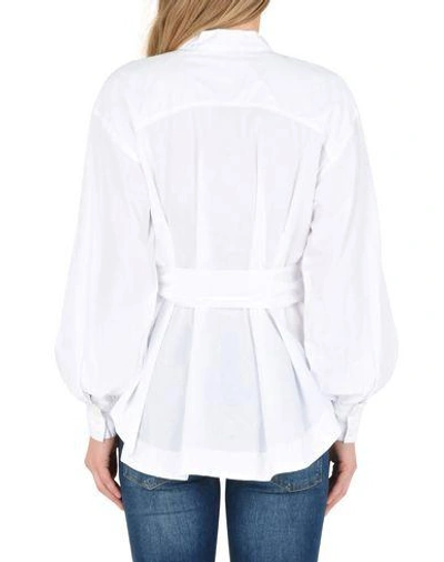 Shop Free People Solid Color Shirts & Blouses In White