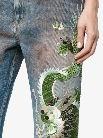Shop Gucci Embroidered Dragon Jeans In Blue