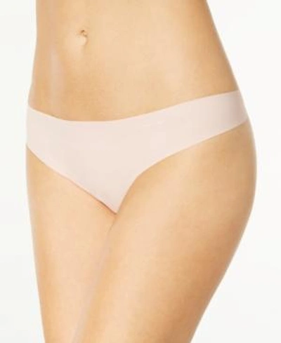 Shop Calvin Klein Invisibles Thong D3428 In Connected