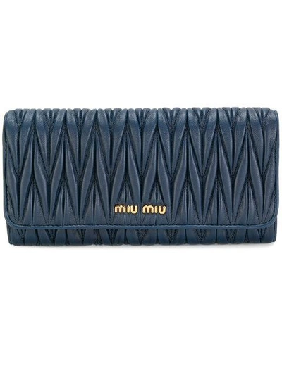 Shop Miu Miu Matelassé Continental Wallet In Blue