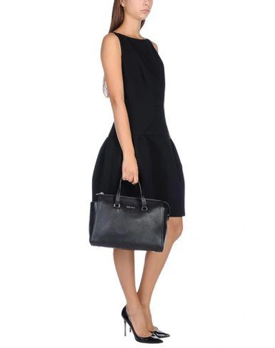 Shop Miu Miu Handbags In Black