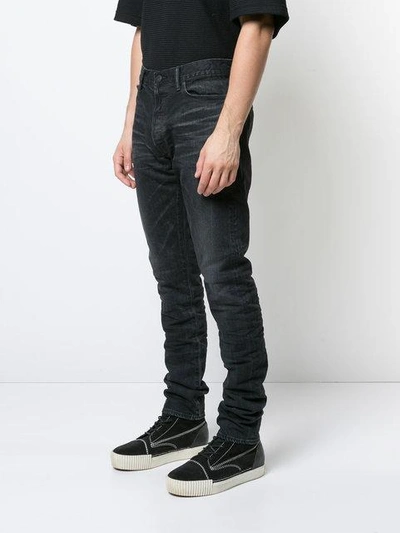 Shop John Elliott Stonewashed Slim-fit Jeans