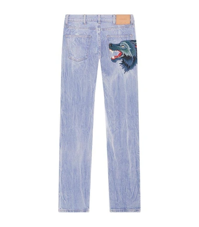 Shop Gucci Appliqué Wolf Cropped Jeans In Blue