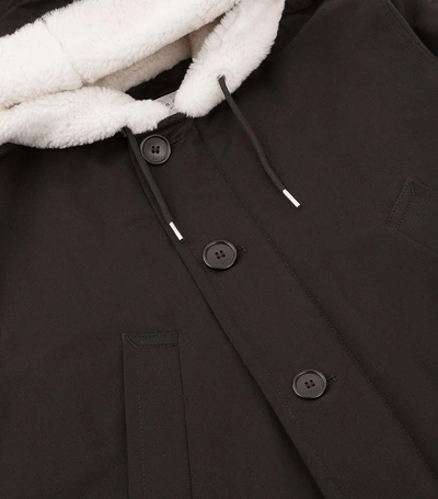 Shop Sandro Sheepskin Trim Hooded Coat In Black