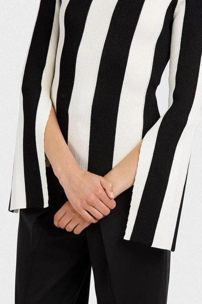 Shop Monse Striped Ribbed Stretch-knit Polo Neck Jumper