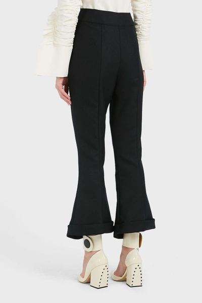 Shop Jacquemus Flared Wool And Cotton-blend Trousers