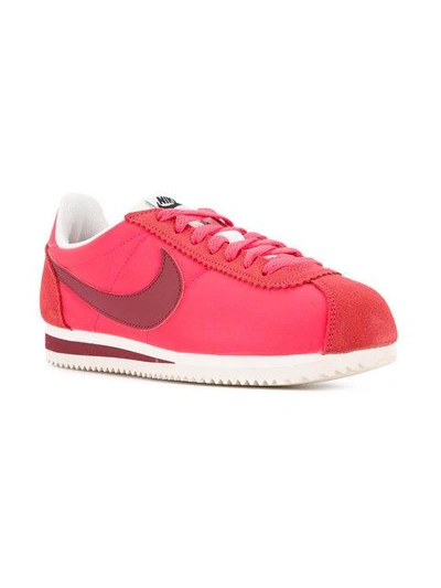 Shop Nike Cortez Sneakers In Red