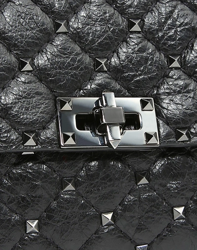 Shop Valentino Garavani Crinkled Lambskin Rockstud Spike Crossbody Clutch In Black