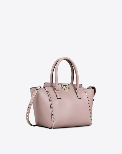 Shop Valentino Small Rockstud Top-handle Bag In Poudre