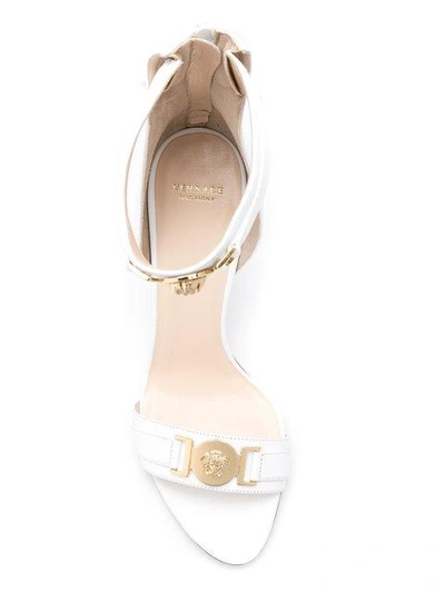 Shop Versace Medusa Embellished Sandals - White