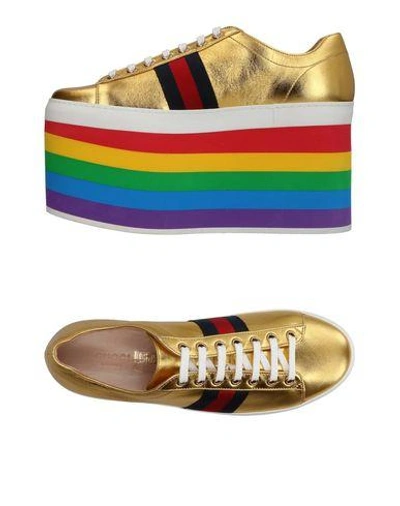 Shop Gucci Sneakers In Gold