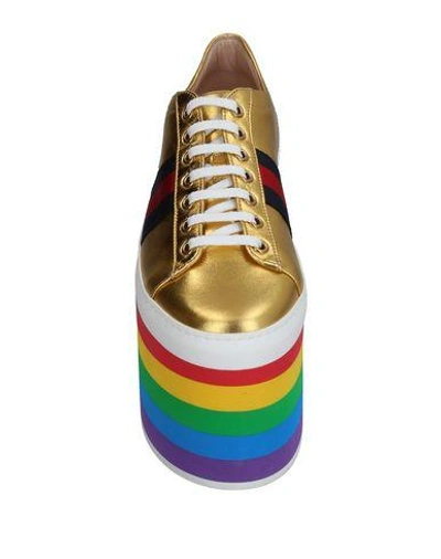 Shop Gucci Trainers In Gold