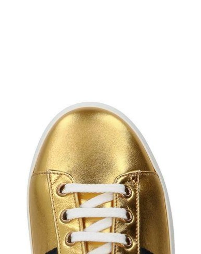 Shop Gucci Sneakers In Gold