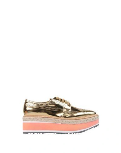 Shop Prada Laced Shoes In Gold