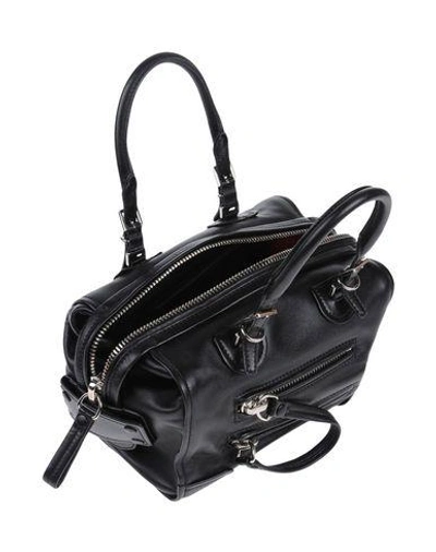 Shop Valentino Handbag In Black