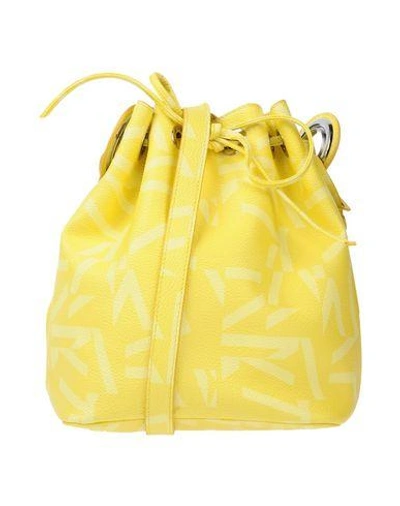 Shop Jil Sander Handbags In Yellow