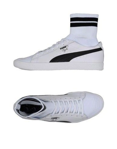 Shop Puma Sneakers In White