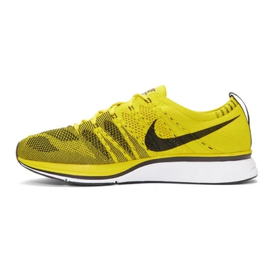 Shop Nike Yellow Flyknit Trainer Sneakers