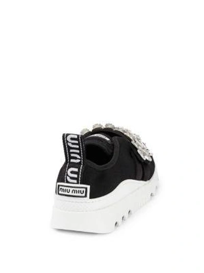 Shop Miu Miu Embellished Sneakers In Black