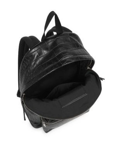Shop Saint Laurent Embossed Leather Backpack In Black