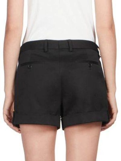 Shop Saint Laurent Pleated Cuffed Shorts In Black
