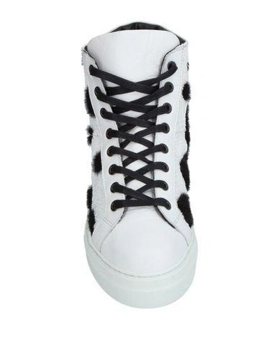 Shop Simon Scott Sneakers In White