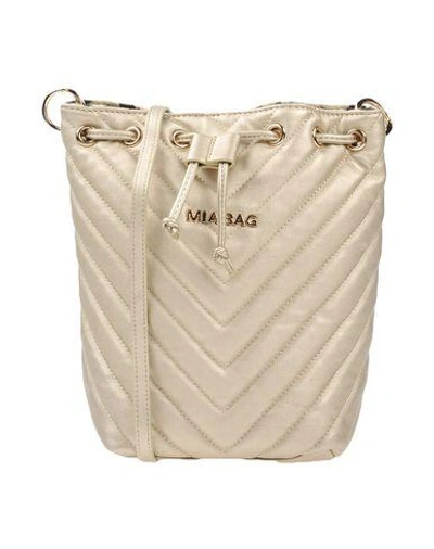 Shop Mia Bag Handbags In Gold