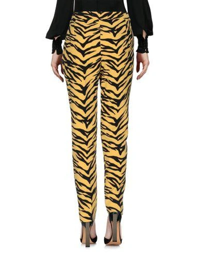 Shop Moschino Cheap And Chic Casual Pants In Yellow