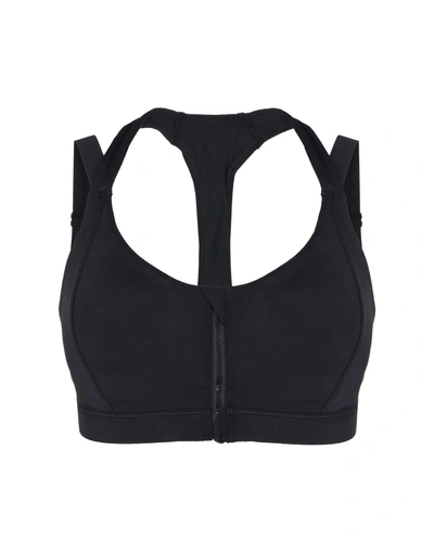 Shop Puma Sports Bras And Performance Tops In Black