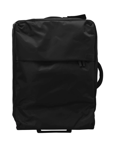 Shop Lipault Wheeled Luggage In Black