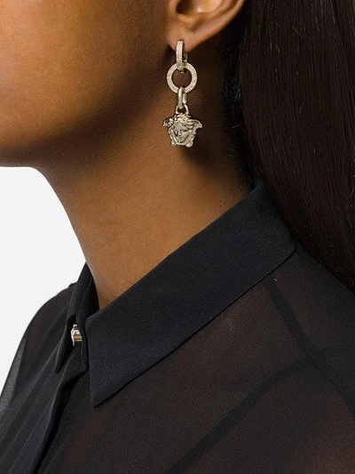 Shop Versace Medusa Drop Earrings In Metallic