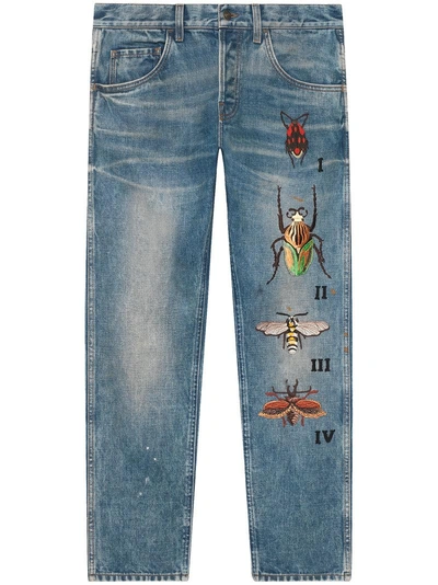 Shop Gucci Tapered Jeans With Insects Embroidery