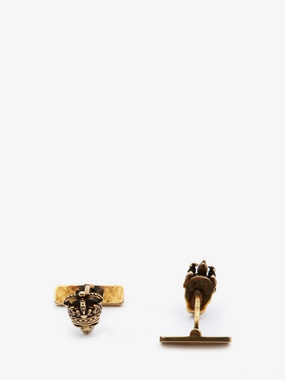 Shop Alexander Mcqueen "queen And King" Skull Cufflinks In Antique Gold