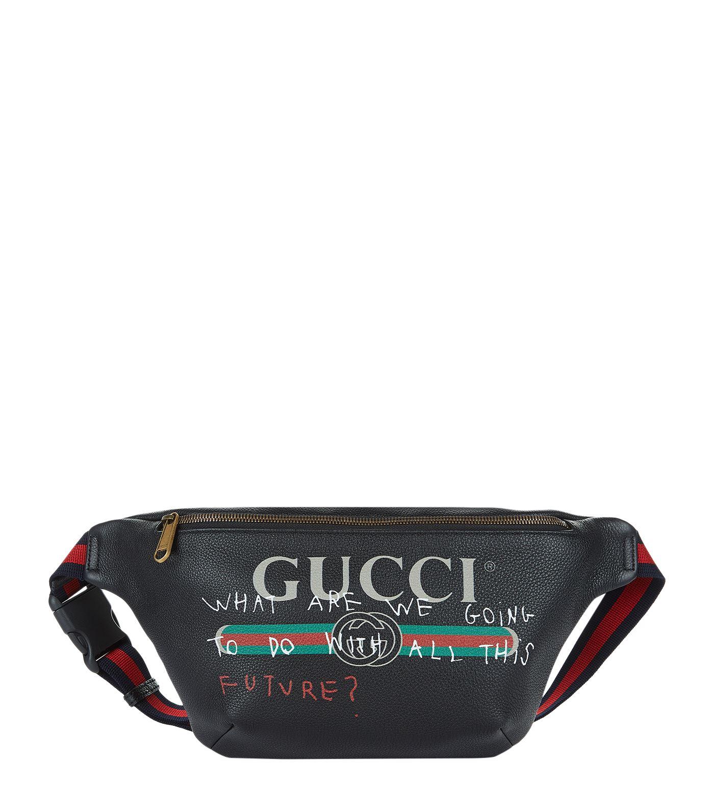 black gucci fanny pack with writing