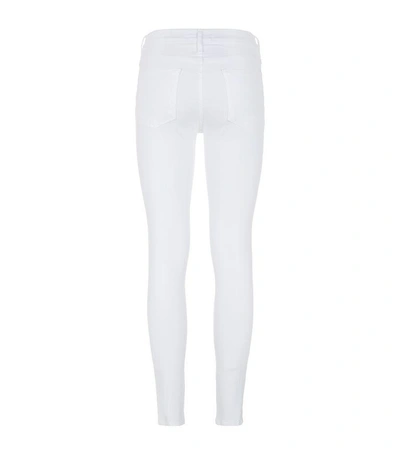 Shop Frame Ripped Skinny Jeans In White