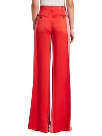 Shop Valentino Hammered Satin Side Panel Flare Trousers In Poppy