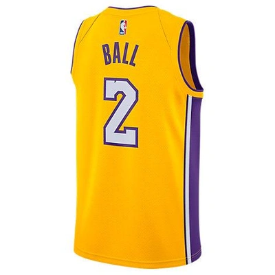 Shop Nike Men's Los Angeles Lakers Nba Lonzo Ball Association Edition Connected Jersey, Yellow