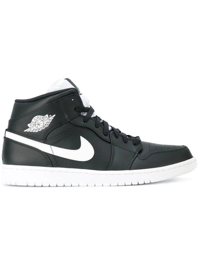 Shop Nike Air Jordan 1 Mid Sneakers