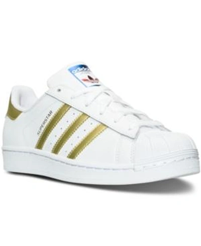 Shop Adidas Originals Adidas Women's Superstar Casual Sneakers From Finish Line In White/gold Met/blue