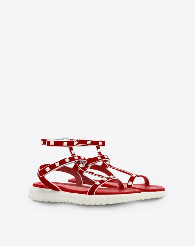 Shop Valentino Free Rockstud Flat Sandal In Red