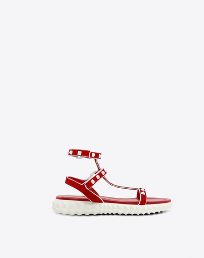 Shop Valentino Free Rockstud Flat Sandal In Red