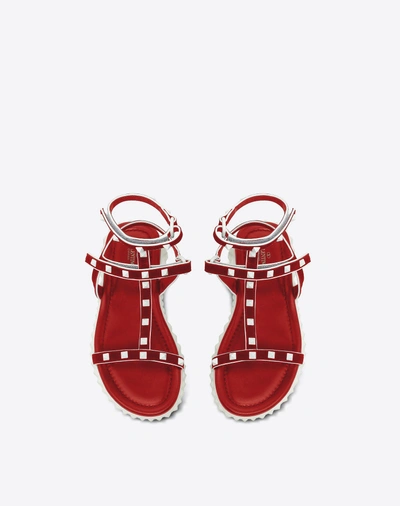 Shop Valentino Free Rockstud Flat Sandal In Red