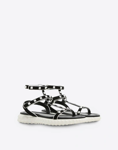 Shop Valentino Free Rockstud Flat Sandal In Black