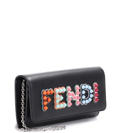 Shop Fendi Embellished Leather Clutch In Eero
