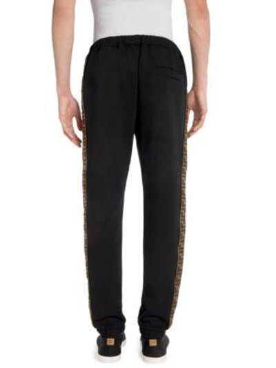 Shop Fendi Zecca Logo Tape Pants In Black