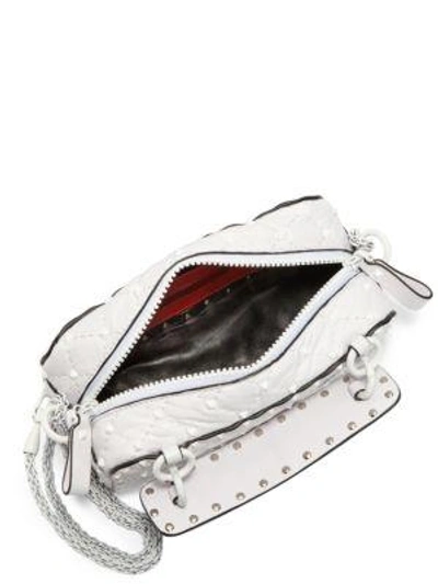 Shop Valentino Studded Leather Crossbody Bag In Red