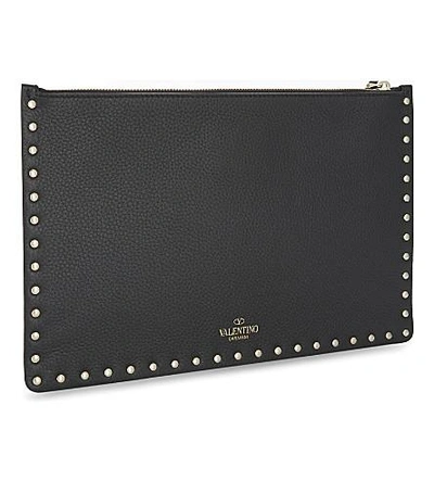 Shop Valentino Rockstud Medium Grained Leather Pouch In Black