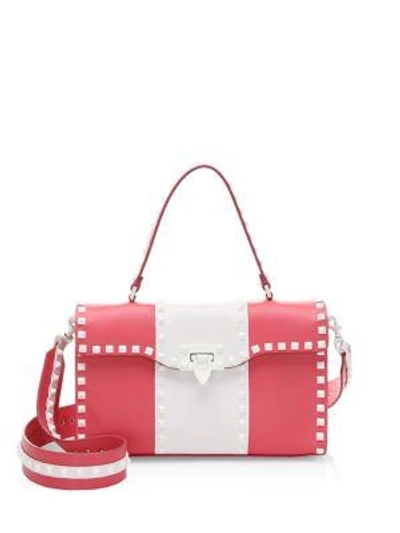 Shop Valentino Studded Leather Crossbody Bag In White-pink