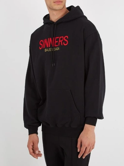 Balenciaga Sinners-embroidered Hooded Cotton Sweatshirt In 1000 - Noir |  ModeSens